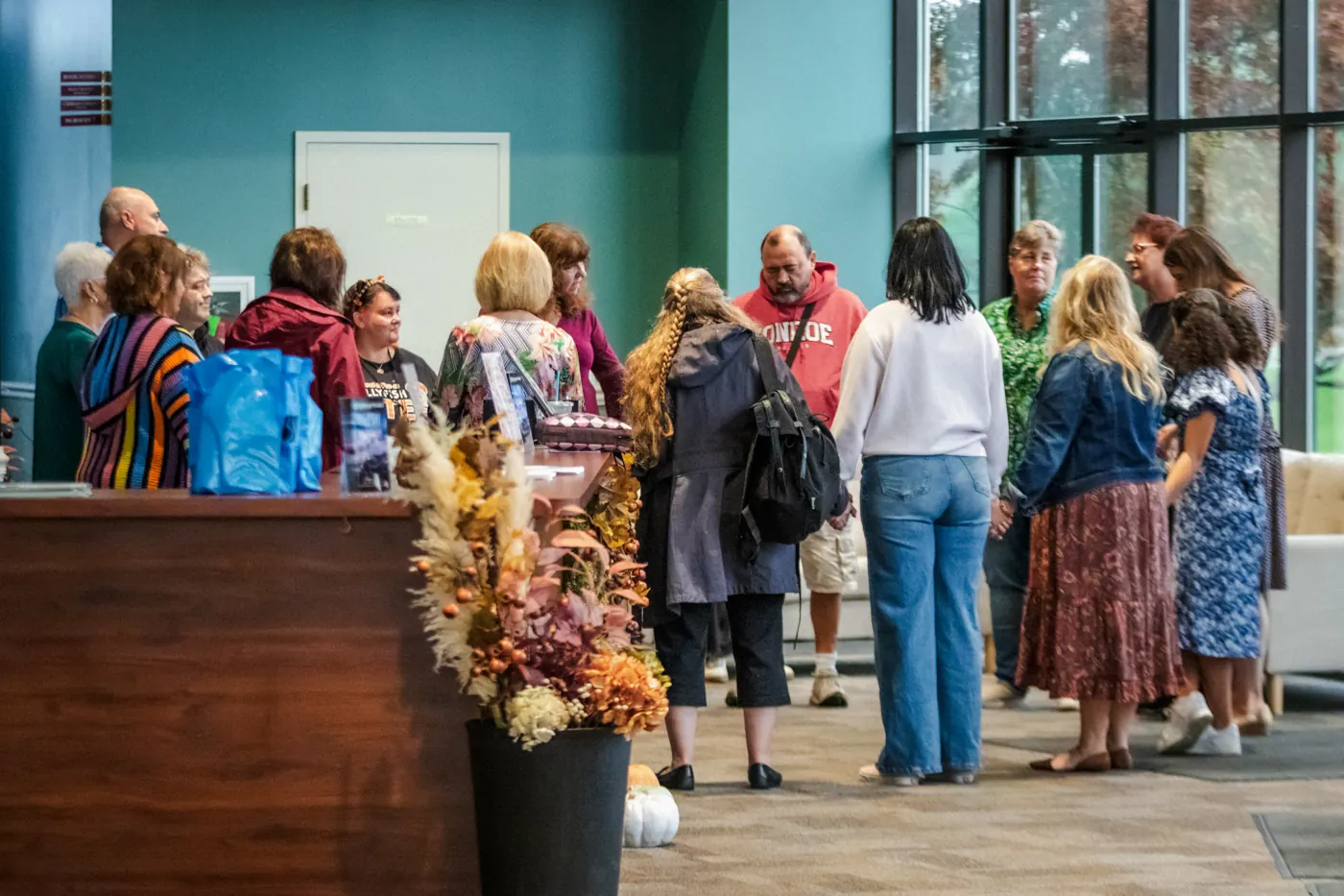 People talking in the church lobby before service